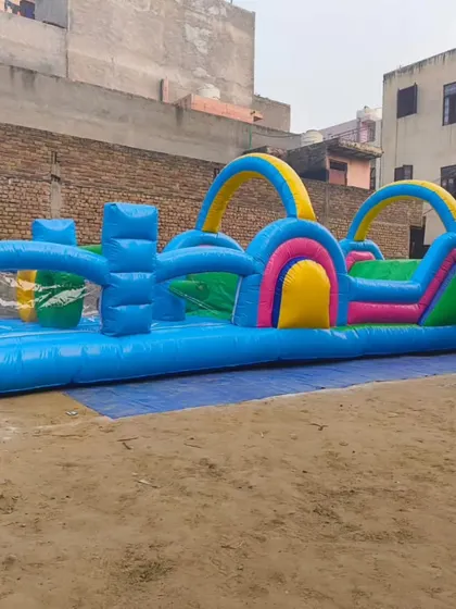 A full view of the new inflatable obstacle course, showcasing its length and the variety of challenges from start to finish.