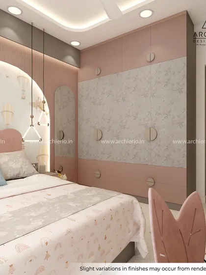 This view shows the custom wardrobe in the pastel-themed kids' room. The combination of pink and textured grey panels adds a modern touch to the playful design.
