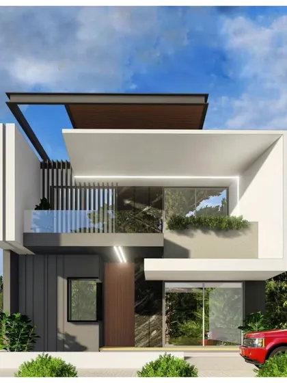 This contemporary home design uses interlocking white and grey blocks to create a dynamic facade. Features like vertical louvers and a glass-railed balcony add texture and a sense of openness.