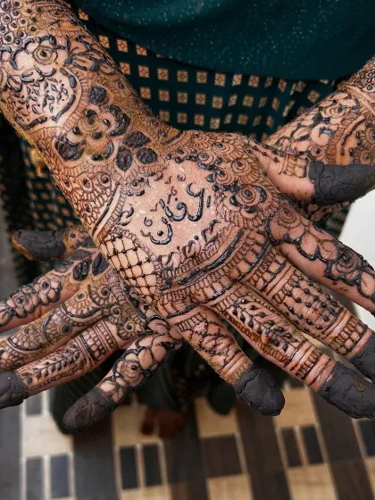 Your mehendi should tell your story. Here, I've carefully woven the groom's name, Irfan, into the intricate bridal design on the palm, making it a beautiful secret for him to find.