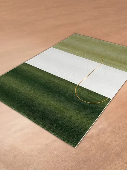 For a fresh and modern look, this rug features a color-block design in shades of green and white, with a single gold line as an accent. It's a simple yet sophisticated addition to any room.