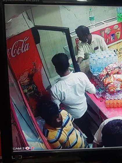 This camera is positioned to get a clear view of the beverage coolers and customer interactions.