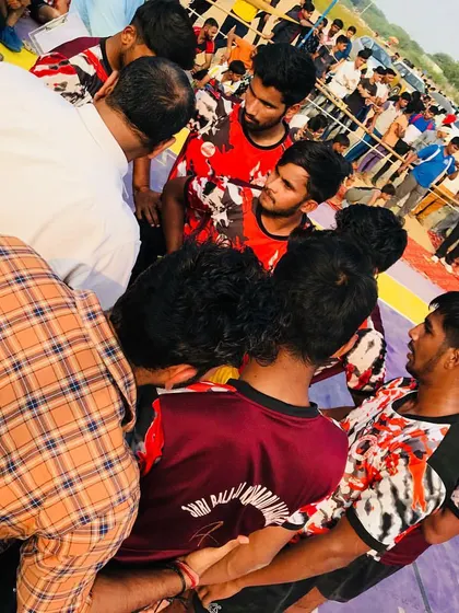 A team huddle before a big raid. Unity and communication are our biggest strengths on the mat.