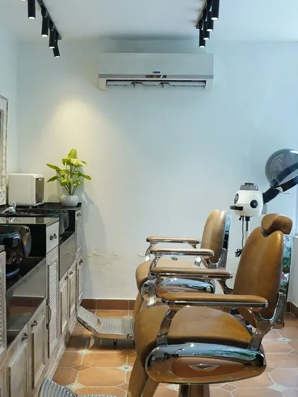 This is my modern and clean men's grooming station. With comfortable vintage-style chairs and natural wood finishes, it’s a space designed for both comfort and style.