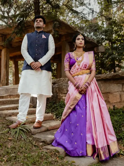 Framed by the rustic charm of The Tamarind Tree, this couple shares a look of love. We specialize in using unique angles and architectural elements to create memorable wedding portraits.