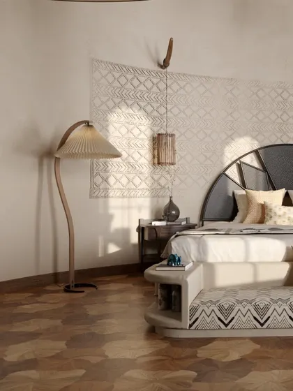 This close-up highlights the rich textures within a guest room. A patterned wall hanging, a unique floor lamp with a pleated shade, and a custom-designed bed with an integrated bench all contribute to a layered and sophisticated interior design.