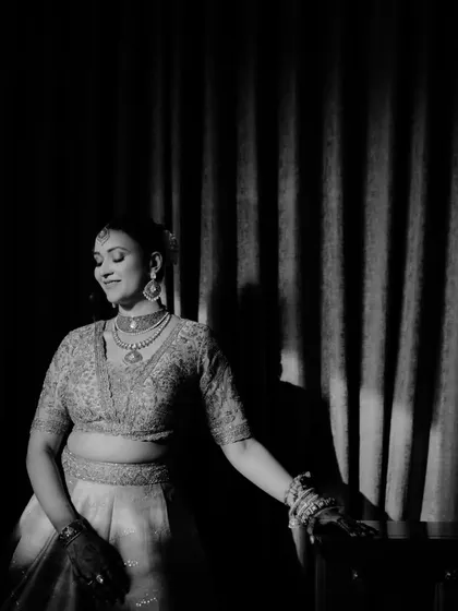 A dramatic black and white portrait of the bride, using light and shadow to create a timeless and artistic image.