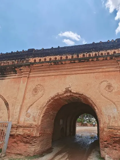 Riding through the arched gateway of the Devanahalli fort. It feels like entering another era.