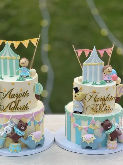 The cutest first birthday party for two sets of twins! I created two matching circus-themed tiered cakes with pastel colors and adorable fondant animals. It was one of the most extravagant party setups I've ever seen.