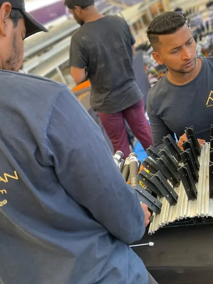 The crew at work, wearing their custom T-shirts, showcasing the practical application of our merchandise services.