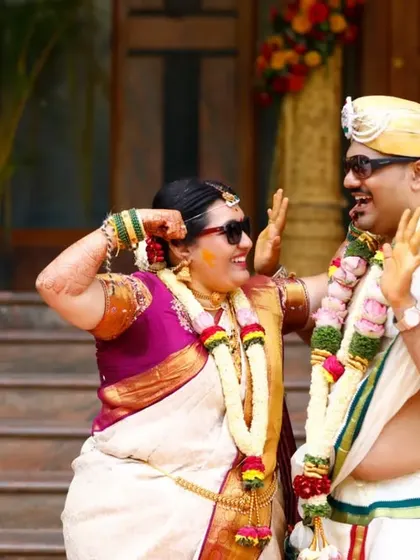 Capturing the fun and playful side of a wedding. This couple's candid laughter and carefree poses make for a memorable and unique wedding photo.