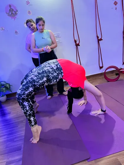 An advanced student holding a perfect wheel pose, demonstrating amazing flexibility and strength.