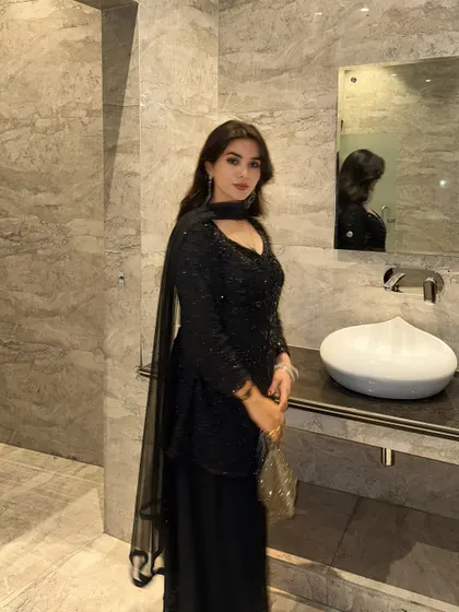 A classic all-black sequined ethnic suit, my go-to for an elegant and modern traditional look.