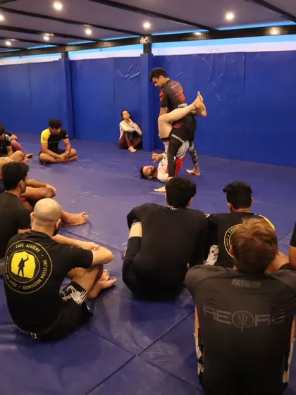 Another angle of the demonstration, showing how we ensure everyone in the room can see the technique being taught. No one gets left behind.