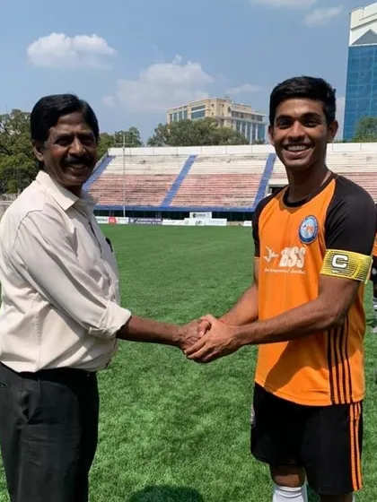 Mayank Mahesh shaking hands after being named captain, a testament to the leadership skills we develop.