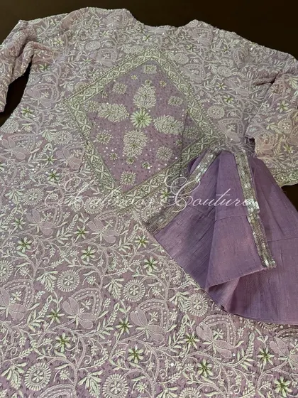 The back of our lilac Anarkali, featuring a stunning diamond-shaped jaal pattern, ensuring elegance from every angle.