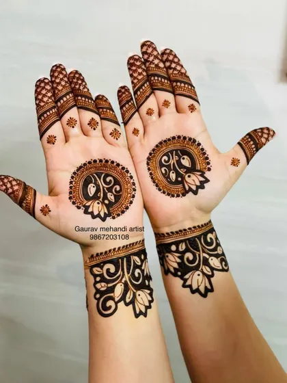A modern take on the traditional mandala. This design features lotus motifs within a circular pattern on the palm, with a matching cuff design on the wrist, offering a clean and contemporary look.