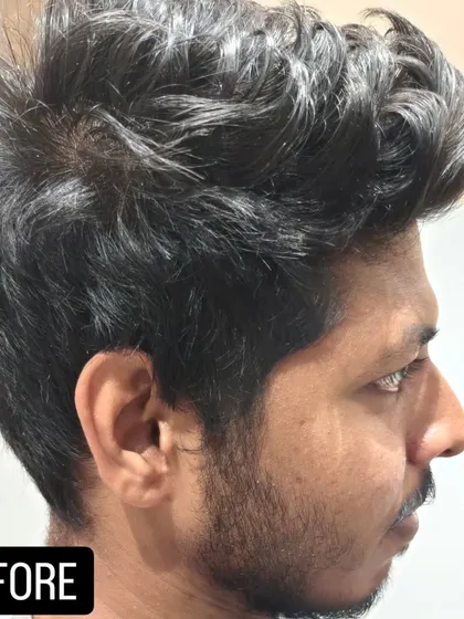 Before the transformation. A side view of a client's hair before his cut and beard trim.