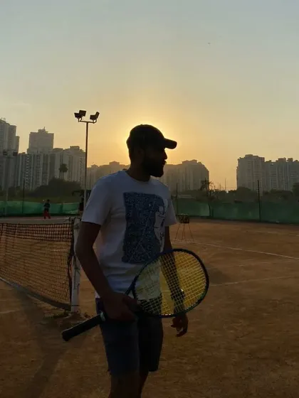 A moment of reflection on the court as the sun sets. Our love for tennis drives us to excel and to help our players do the same.