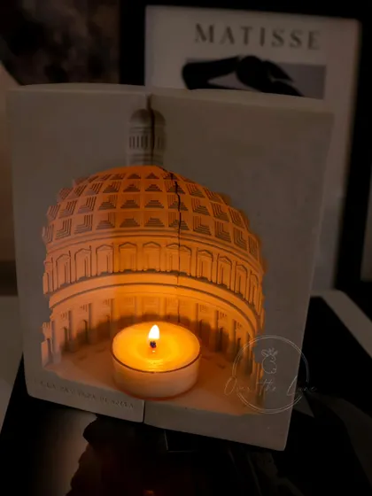 My Pantheon eco-resin tealight holder, casting a warm glow. When you place two of these together, they form the iconic dome, creating a stunning lamp.