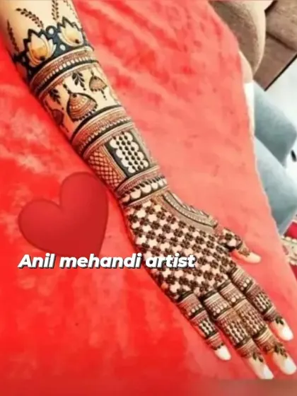 A close-up of a single arm, showing a design with hanging jhumkas and lotus motifs. The checkered pattern on the hand is very neat and precise.