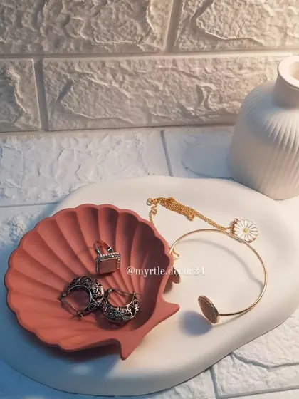 A beautiful styling of our oval cloud tray and mini shell dish. The combination of different shapes and a cohesive color palette creates a lovely display.