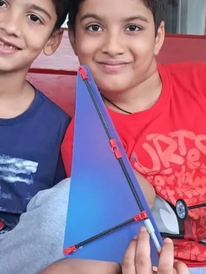 A duplicate of ID 137, showing two happy brothers with their collaborative project.