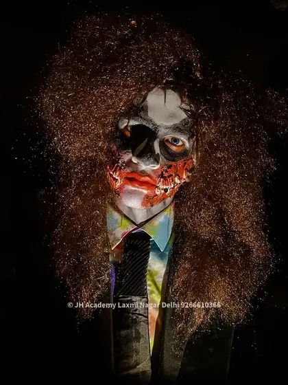 A close-up of a zombie makeup look with wild hair, perfect for a Halloween portfolio. Our training helps students build a diverse range of creative looks.