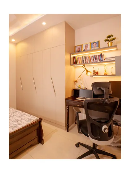 A minimalist study area combined with a full-height wardrobe. The design maximizes space and functionality without compromising on style.