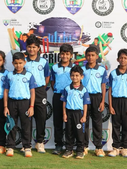 A junior team in blue poses for a photo at the RSCA League.