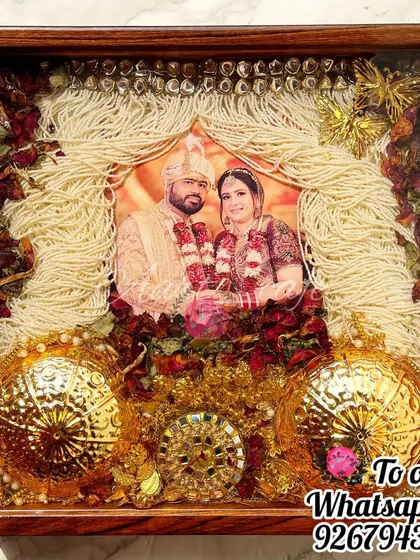 A full view of the sehra, kaleera, and varmala preservation frame. It’s a complete narrative of the wedding attire, captured forever in a dark wood frame.