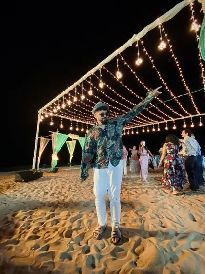 Bringing the party to a destination wedding in Goa. Here I am, pointing to the stars, but really just getting ready for another dance performance on the beach under the beautiful night lights.