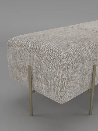 A close-up of the bench's corner, showing the fine-textured upholstery and the elegant design of the gold-finished metal legs.