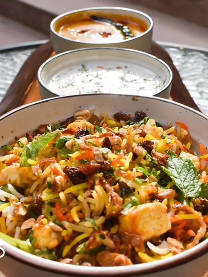 Here's another look at my Nizami Tarkari Pulao, served with raita and salan. It's a complete, filling meal that's packed with warming flavors and textures.