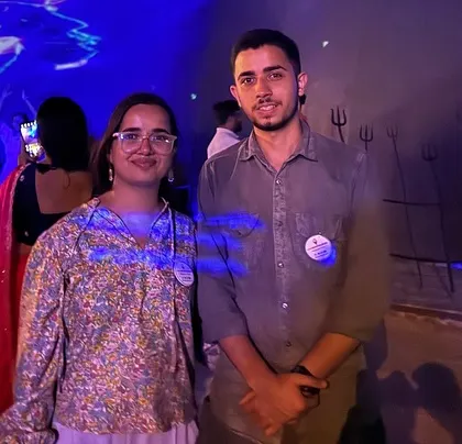 A couple posing in front of the Adiyogi statue during the laser show. A magical and memorable experience.