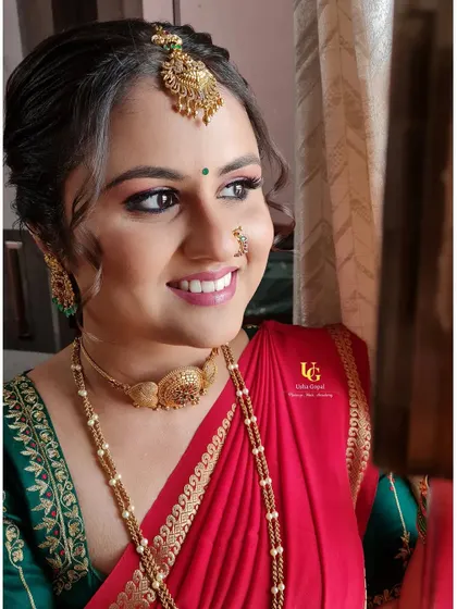A lovely candid shot of Varshini, capturing her happy expression and the beautiful details of her ring ceremony look.