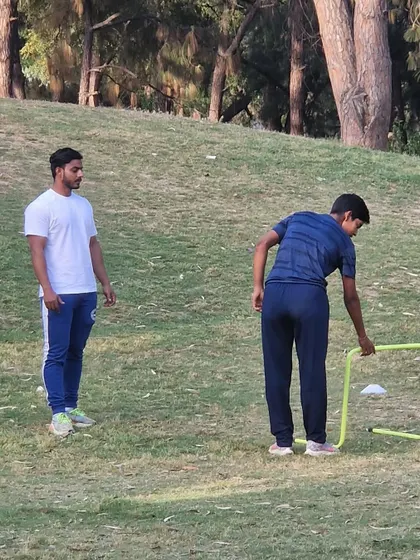A young athlete setting up equipment for a drill. I encourage my players to take ownership of their training.