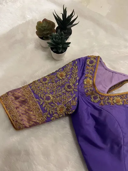 A closer look at the stunning handwork. Every thread is placed with care to create a work of art.