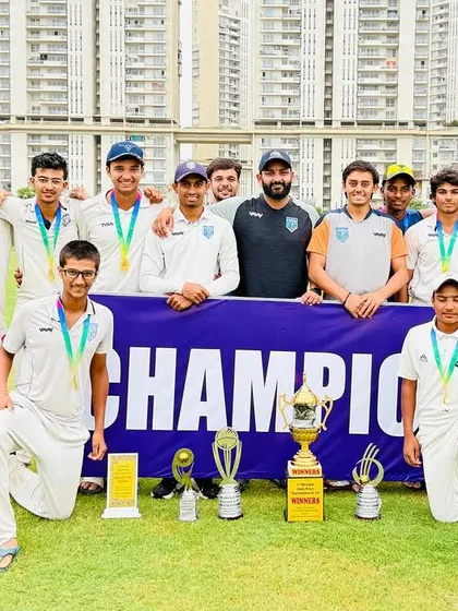 The full U-19 squad with their medals and trophies after a successful tournament campaign.