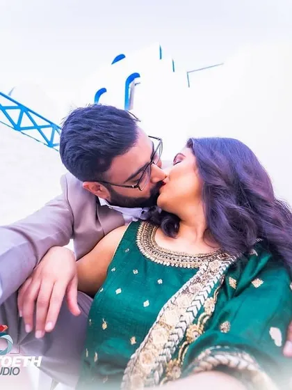 A creative, low-angle shot capturing an intimate kiss between Pankaj and Anushree. I use different angles to add artistic flair to a couple's photo gallery.