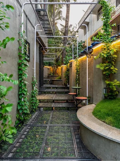Even the narrowest urban plots can become a green escape. In this Mumbai project, I used vertical climbers and a carefully planned layout to transform a tight alleyway into a lush, functional courtyard space.