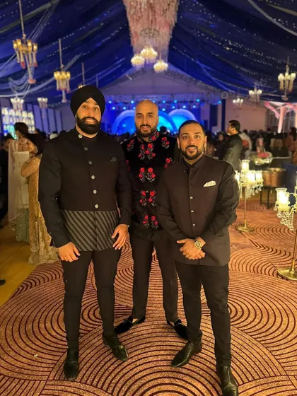 The crew dressed for a grand reception in Delhi, India. We always match our style to the event's dress code, whether it's black tie or traditional wear.
