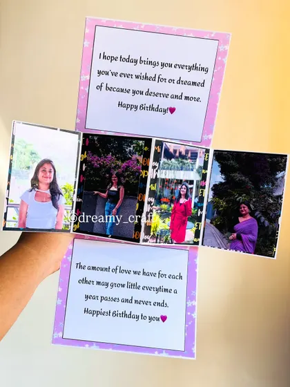 This is the inside of a pop-up card, which works like a mini explosion box. It opens to reveal four photo panels and two messages for a birthday surprise.