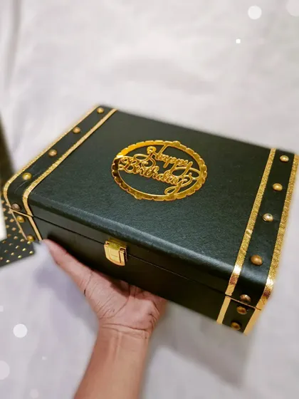 Holding up a finished Trunk Box hamper. You can feel the quality and care that goes into each one.