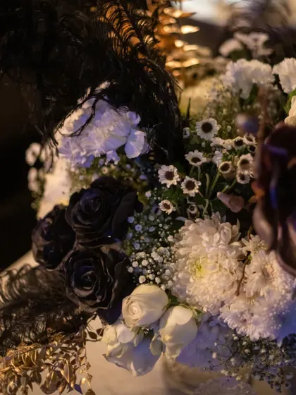 The rare beauty of black roses is highlighted in this close-up. We source unique and exotic blooms to create truly one-of-a-kind floral designs that leave a lasting impression.
