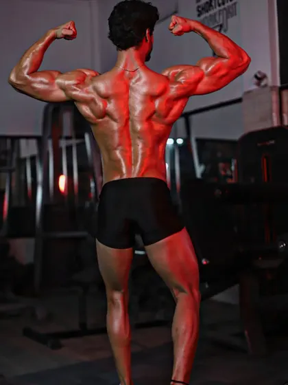 Same pose, different lighting. A well-developed back is a show-winner, and I train it with the intensity it deserves.