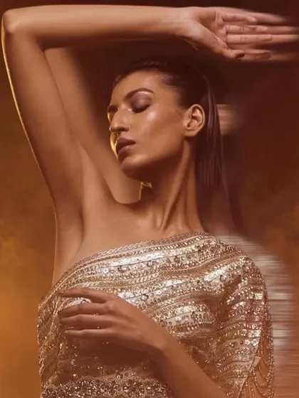 This one-shoulder embellished gown is pure glamour. The sequin work and modern silhouette make it an ideal choice for a sangeet or cocktail night where you want to dance the night away in style.