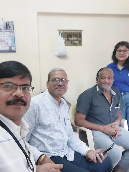 A selfie of our team with the smiling committee members of a newly solar-powered housing society.