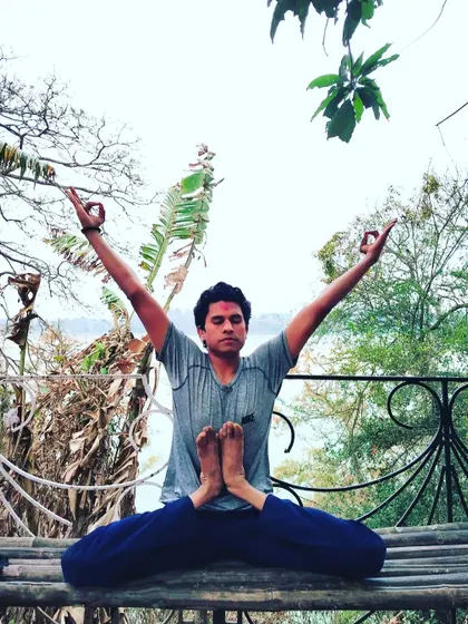 This variation of Baddha Konasana with arms raised opens the hips and chest simultaneously. Asana provides the firmness to live with equanimity, bringing steadiness to the body, intelligence, and spirit.