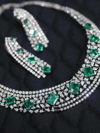 A modern take on a classic design, this emerald and diamond necklace is perfect for the contemporary woman. The clean lines of the emeralds paired with the sparkle of diamonds make it both elegant and edgy.